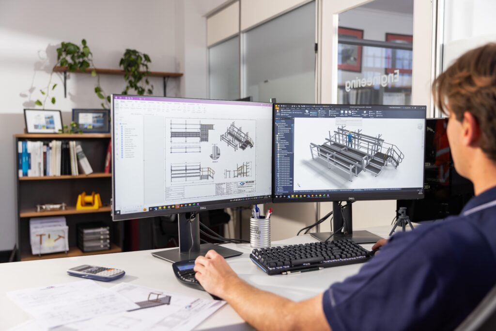 Expert Neumann Engineering consultant reviewing a tailored engineering design solution.